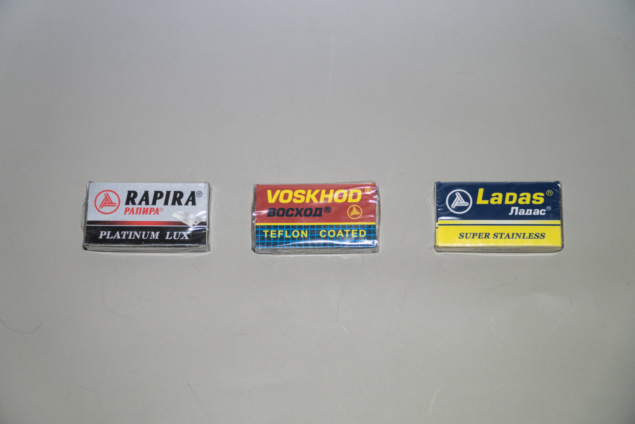 A box, each, of Rapira Platinum LUX, Voskhod, and Ladas razor blades