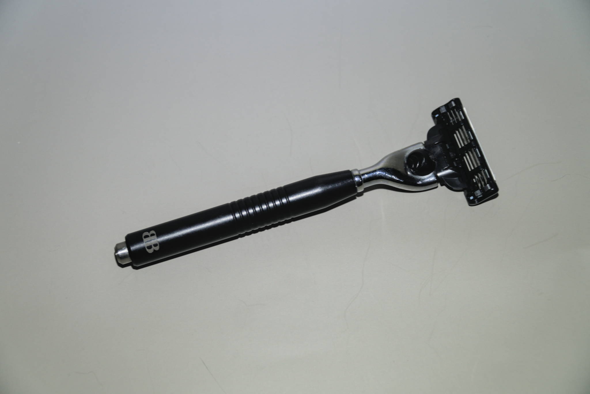 A custom Mach3 blade handle with blade attached