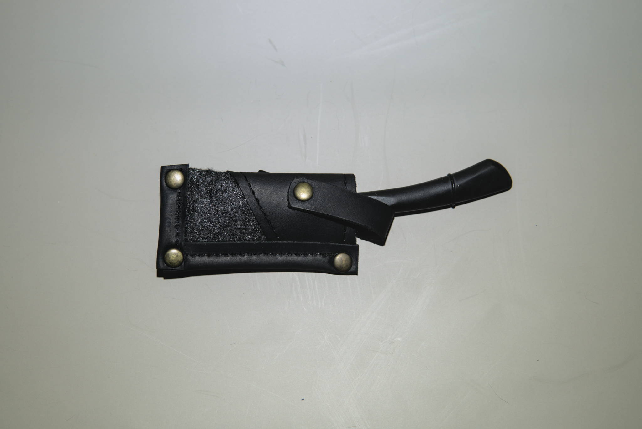 A swappable blade, fixed handle straight razor in a case