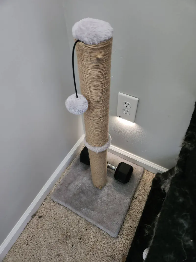 The rewrapped cat scratcher using a sailor's whipping