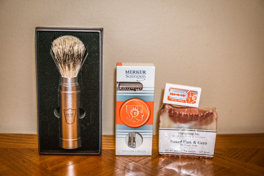 A shave brush, DE safety razor, blades and soap