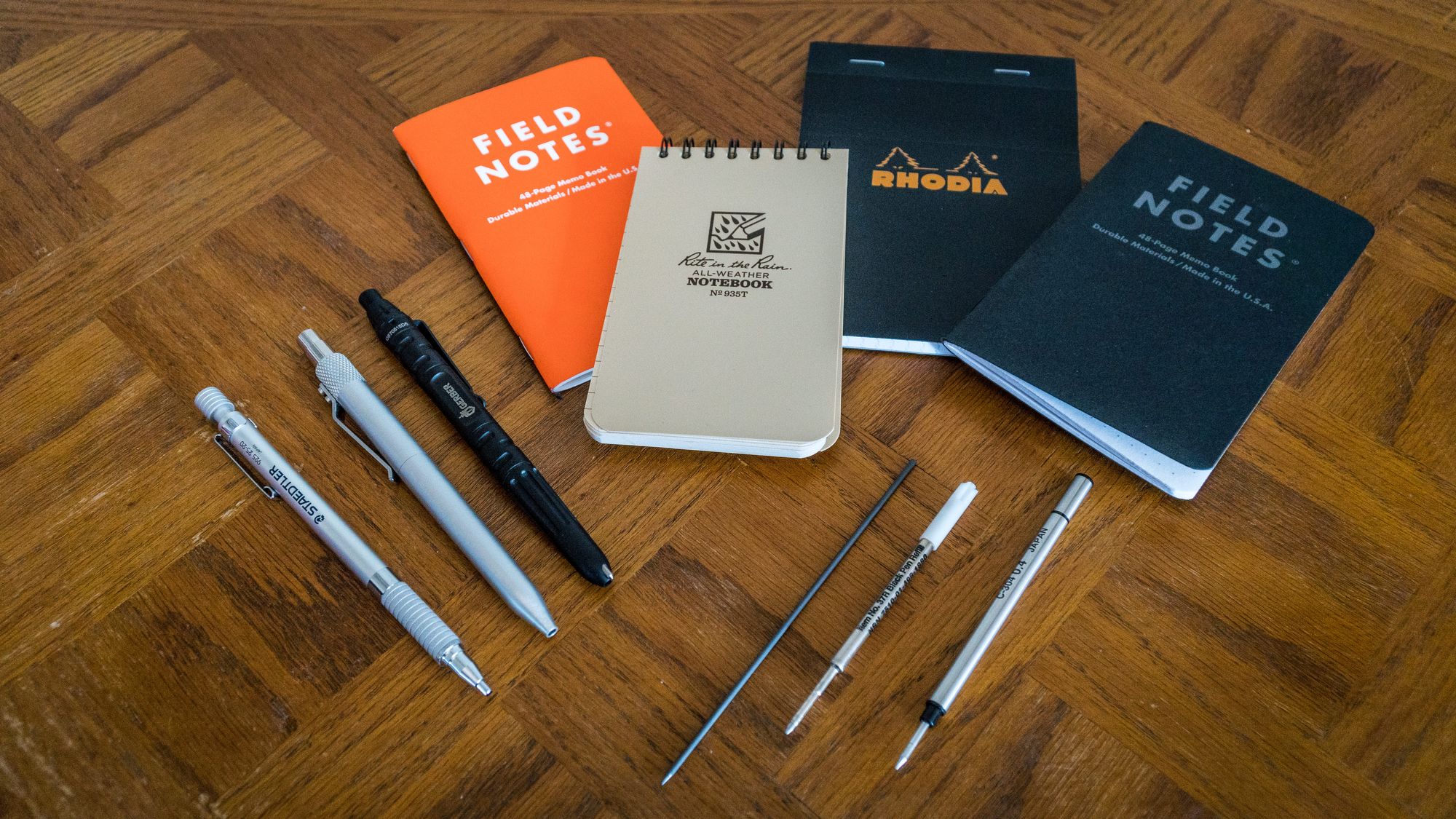 Four notebooks, 3 pens, 3 pen refills